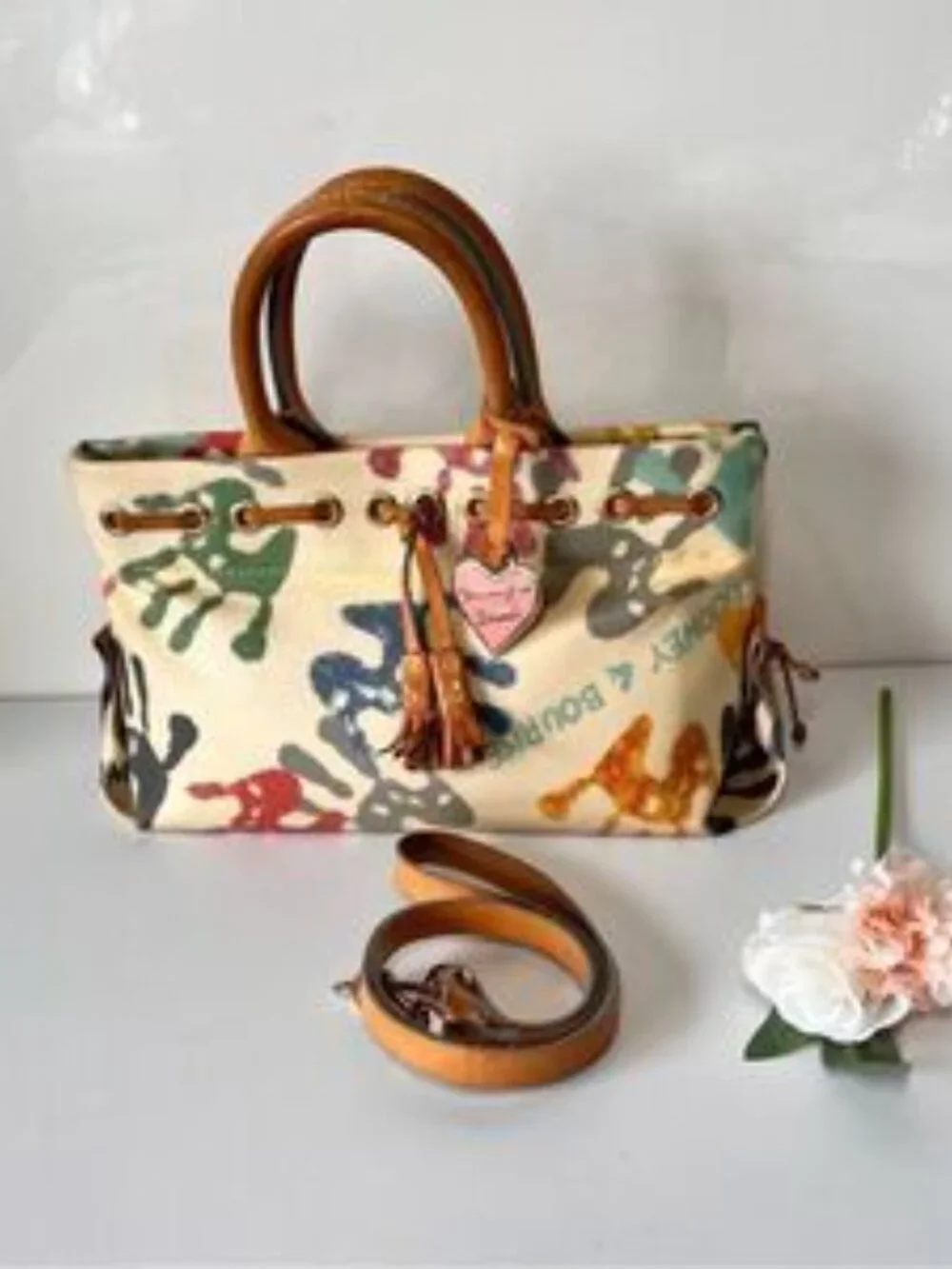 DOONEY & BOURKE Authentic Vintage Y2K Leather Baby Hands Print Tassel Bag